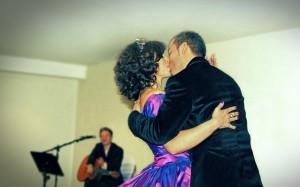 wedding first dance with couple kissing and guitar in background